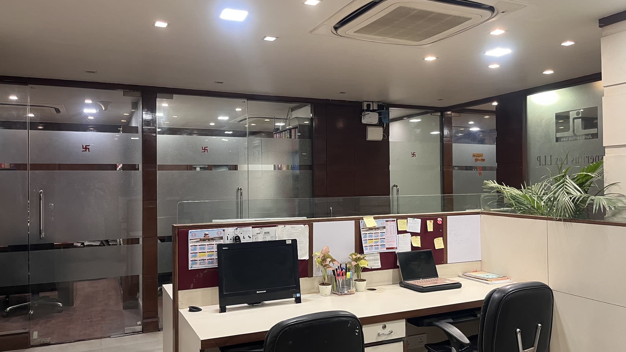 Row of office cubicles with logo walls