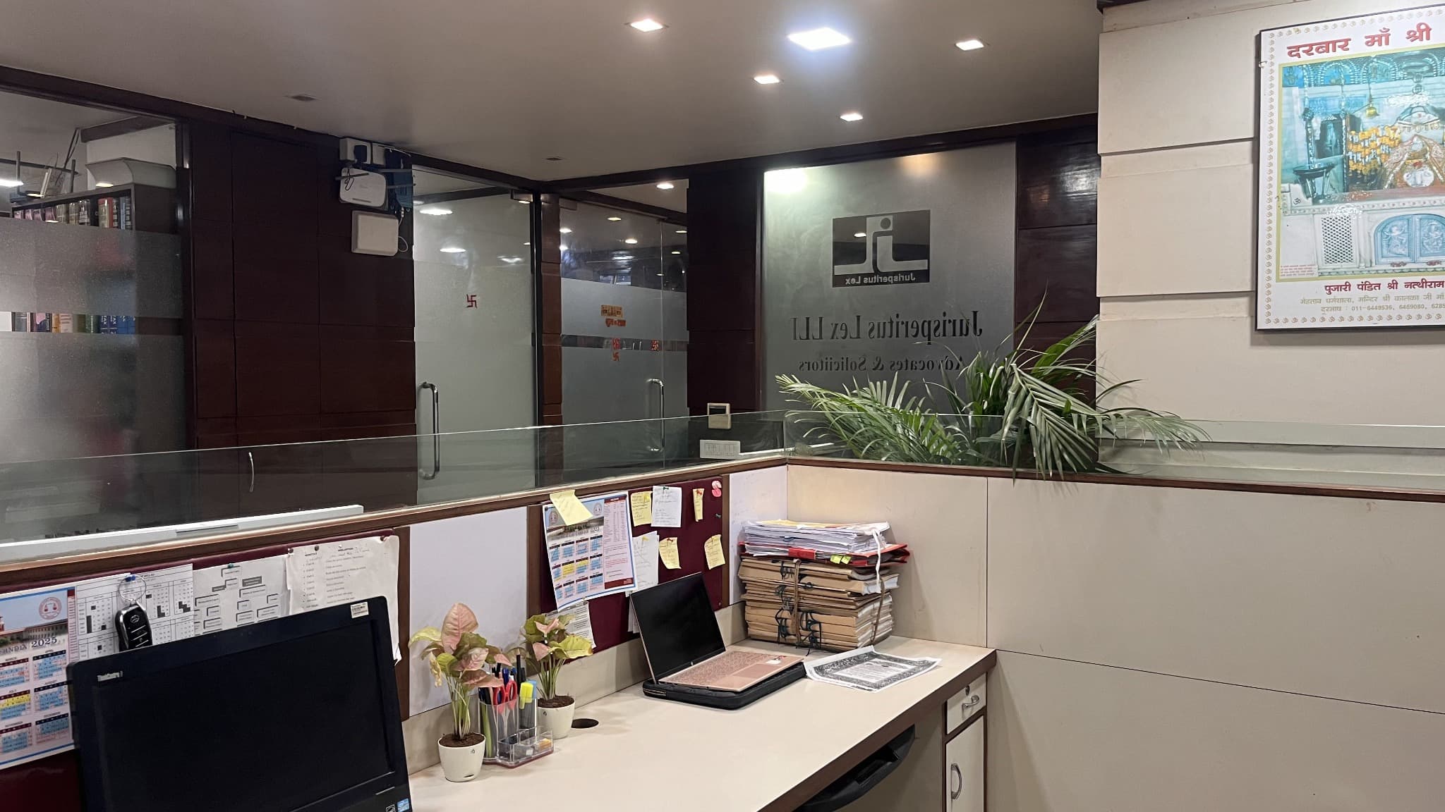 Cubicle desk with laptop and files