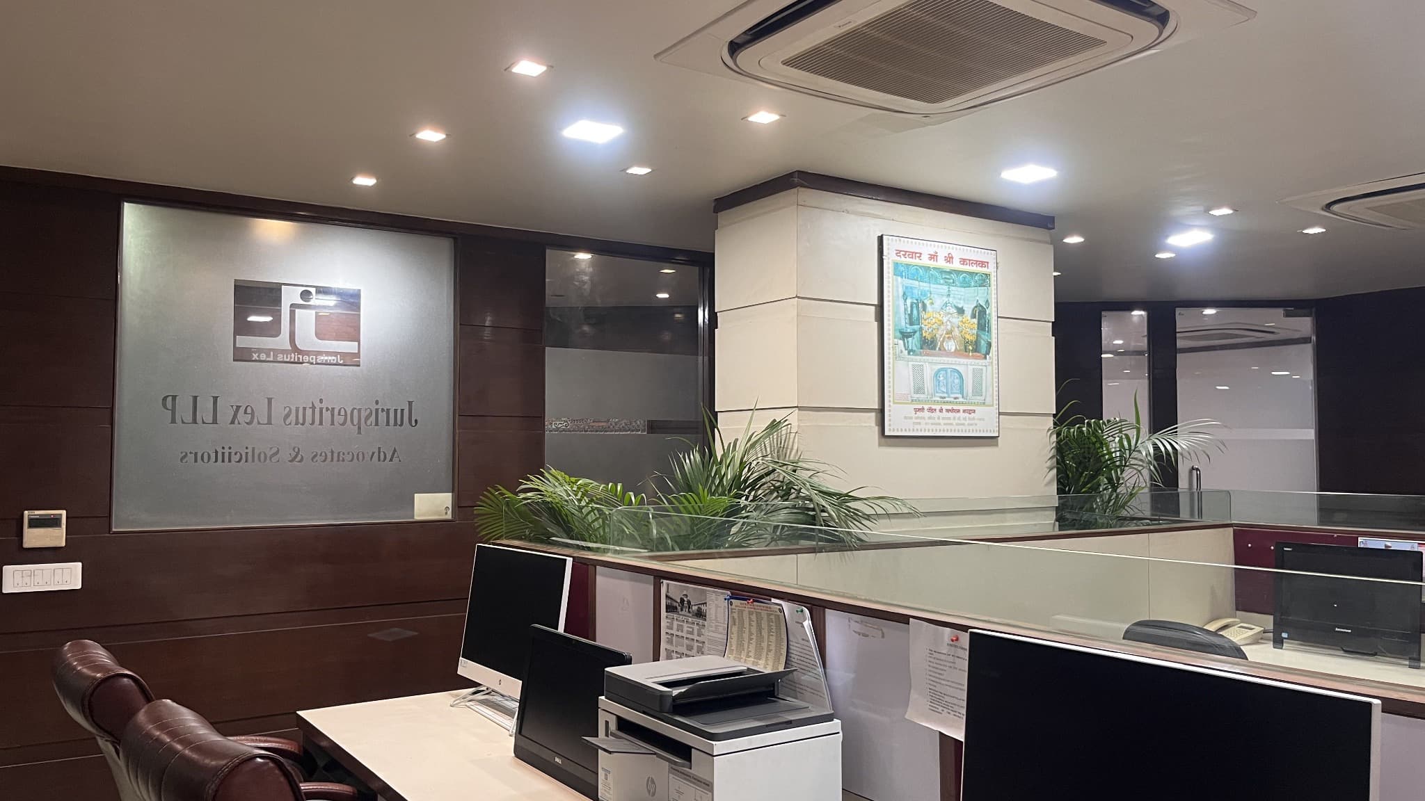 Office desk with computers and printer